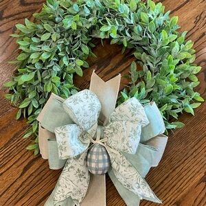 Green Boxwood Holiday Wreath with Decorative Ribbon and Egg Accent